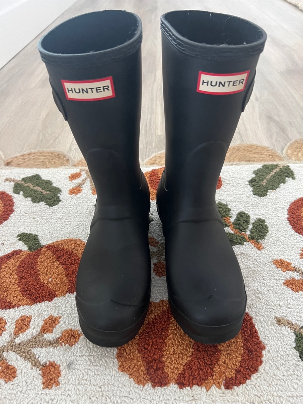 Hunter Women’s Black Tall Rubber Rain Boots with Red Logo Trim
